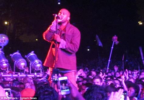 kanye west rocks out on stage in new york¿ while pregnant kim kardashian entertains herself at