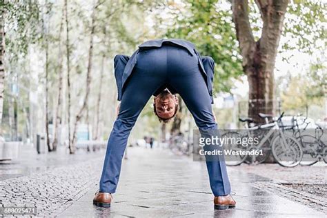 man bending over from behind bildbanksfoton och bilder getty images