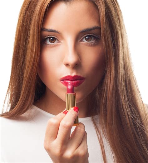Free Photo Sexy Brunette Applying Red Lipstick