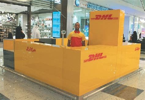 dhl express opens  retail service point  mall  qatar construction business news middle east