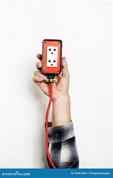 hand holding electricity power plug isolated  white background stock image image  hand