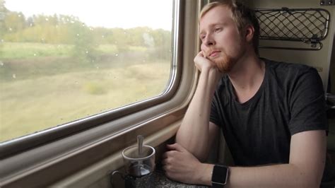 man   window sitting  train stock footage sbv  storyblocks