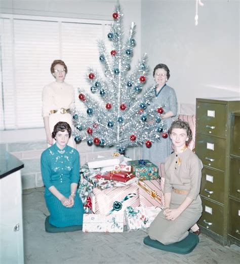 mid century women enjoying aluminum christmas trees flashbak