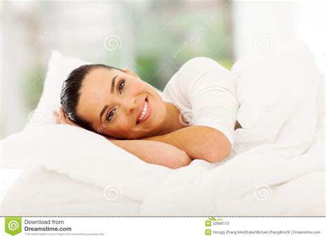 woman relaxing bed stock image image  attractive female