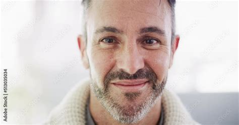Portrait Of A Handsome Smiling Mature Mans Face With A Grey Beard