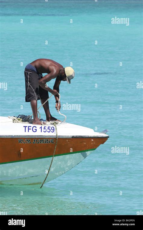 man  motor boat tobago stock photo alamy