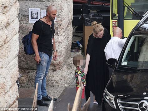 adele opts for a low key look as she steps out with son