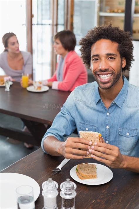 Handsome Man Eating A Sandwich Stock Image Image Of Cafe Cafeteria