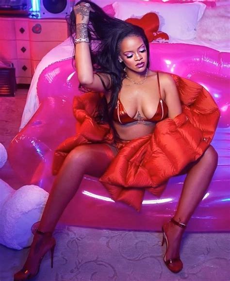 Rihanna Spills From Plunging Red Hot Bra As She Promotes