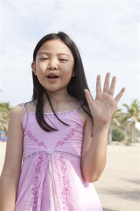 face of asian girl show finger acting as a symbolic of number stock