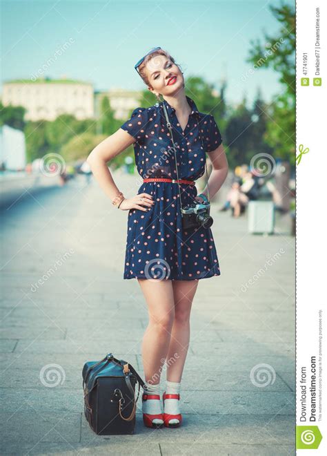 Beautiful Woman In Fifties Style With Braces Holding Retro