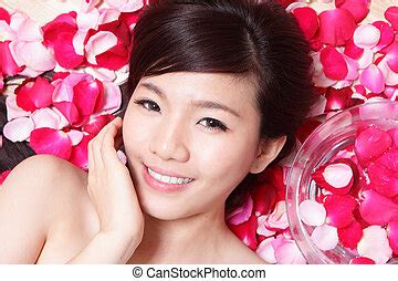 health spa woman face  red rose health spa woman face close