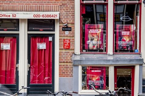 sex workers to wear gloves and masks as amsterdam s red light district