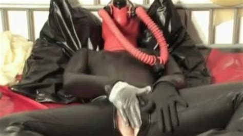 girl in heavy rubber latex breath play with mask gag mouth and gas