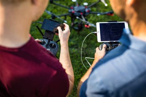 handsome young man flying  drone outdoors stock image image  hood hipster