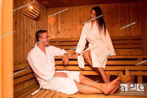 Portrait Of A Young Happy Beautiful Couple Enjoys Relaxing In The Sauna