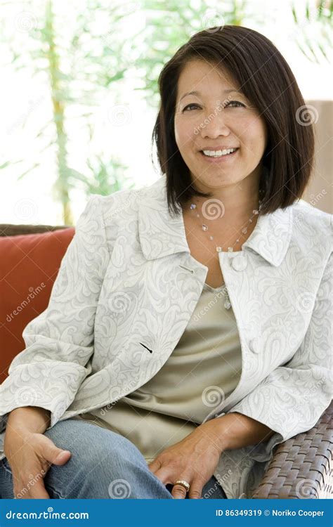 beautiful mature confident asian woman smiling stock image image of