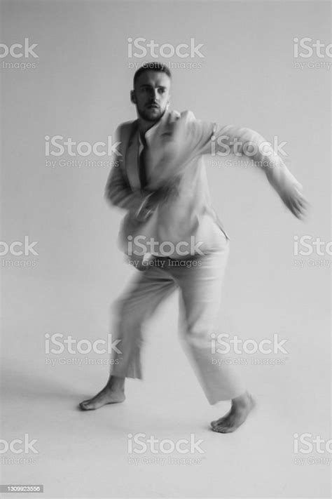 Portrait Of A Dancing Guy With Blurred Background And Long Exposure