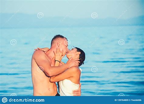 couple in the water kissing and embracing stock image