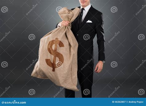 businessman carrying sack  dollar sign stock image image  horizontal money