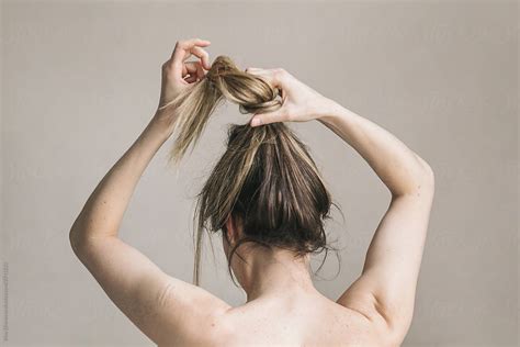 Woman Letting Her Hair Down By Stocksy Contributor Irina Efremova