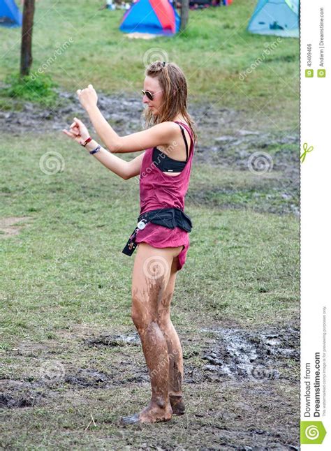 girl dancing in the mud on ozora festival editorial photo
