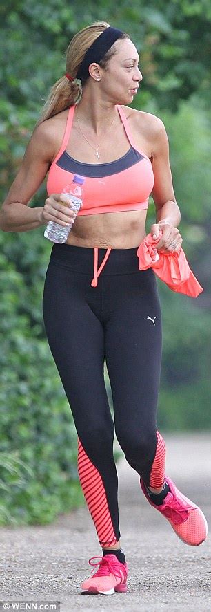 lilly becker shows off her ample assets in sports bra as she goes for a