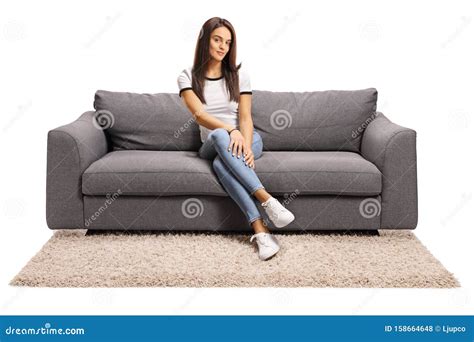 young woman sitting   gray sofa stock photo image  comfortable living