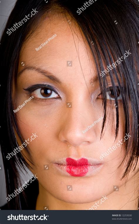 Close Up Of A Beautiful Asian Girl Showing Her Cat Eye