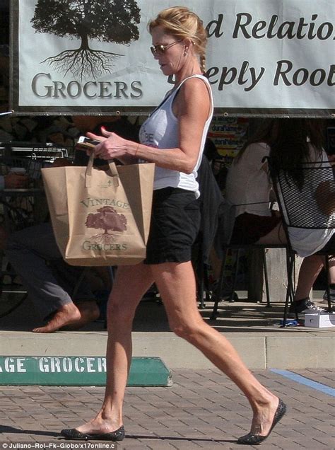 melanie griffith shows off her long shapely legs daily mail online