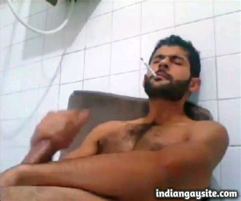 pakistani gay video of a sexy desi hunk jerking off while smoking and cumming hard indian gay site