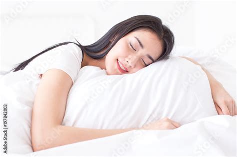 portrait of beatiful asian woman sleeping on bed with attractive