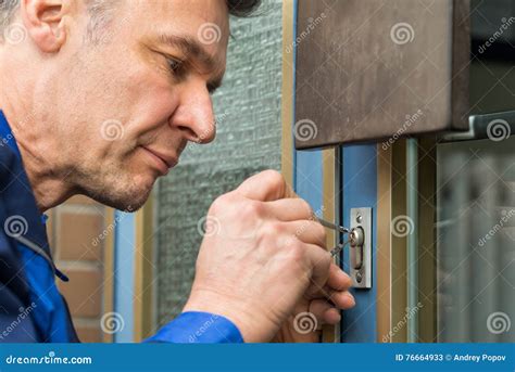 male lockpicker fixing door handle  home stock image image  pick