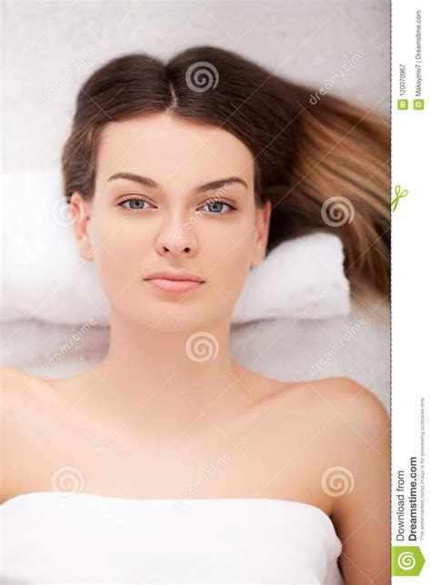 spa beautiful young woman   face treatment  beauty sa stock