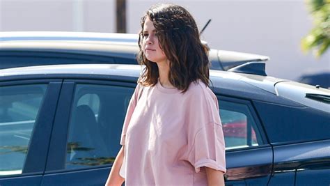 selena gomez wears pink shirt and sweatpants in los angeles pics hollywood life