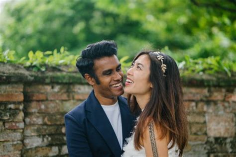 Interracial Couple Indian Man Chinese Woman Pose For Wedding Photo