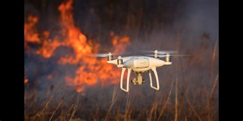 flamethrower drones remove debris  power lines  terrifying video