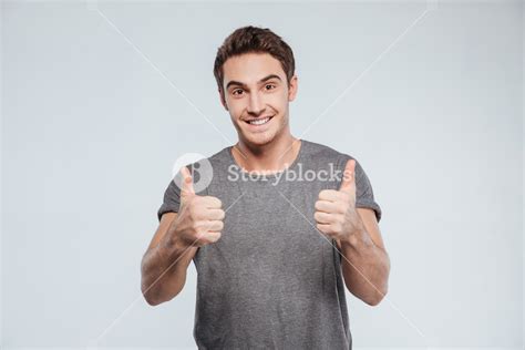 portrait   happy smiling man showing  thumbs  isolated