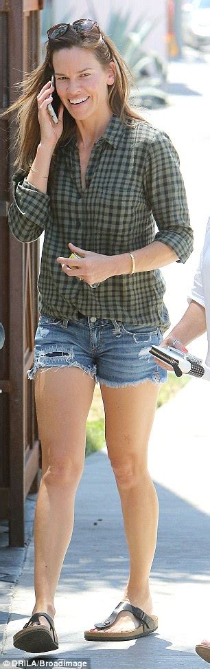 million dollar babe hilary swank 40 shows off her toned legs in cut