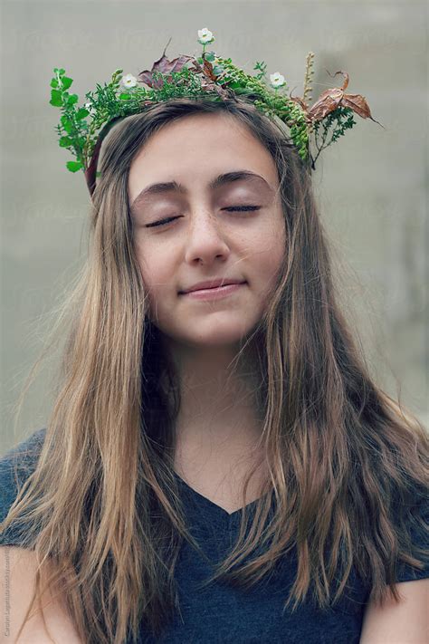 teen girl with long hair and her eyes closed homemade wreath of