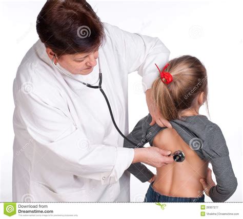 Senior Doctor Listening Girl With Stethoscope Stock Image