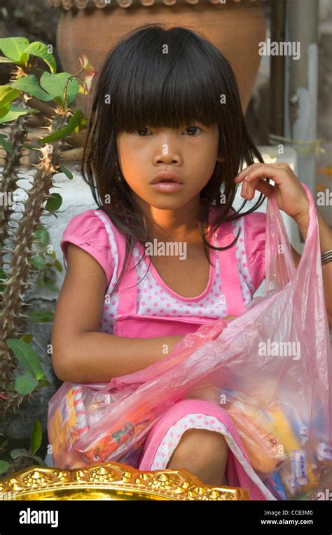 Lao Girl Waiting For Sweets On Mount Phousi On The First Day Of The