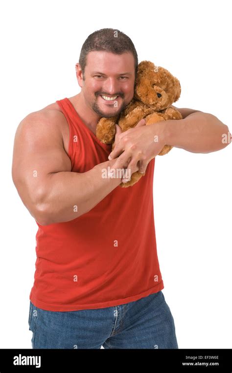 muscular man cuddling  teddy bear stock photo alamy