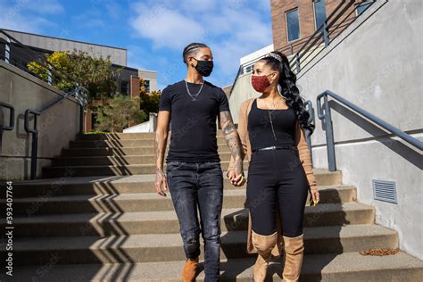 African American Lesbian Couple Wearing Face Masks Holding Hands And