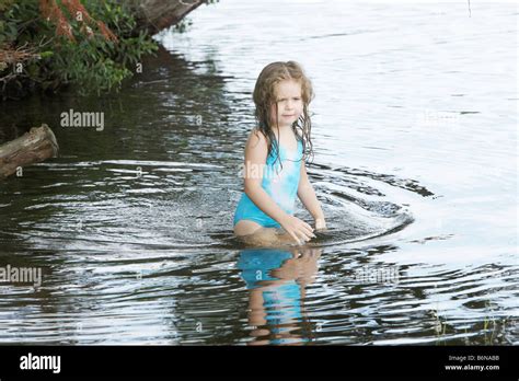 girl wading  water stock photo alamy