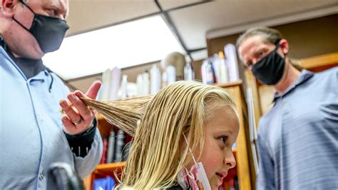 dads learn how to do daughters hair at taylor and burton salon classes