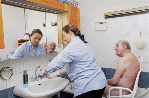 Nurse Washing Elderly Person Stock Image C006 3886 Science Photo
