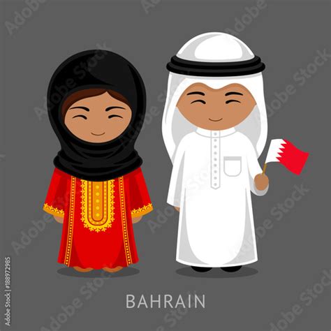 bahrainis in national dress with a flag man and woman in traditional