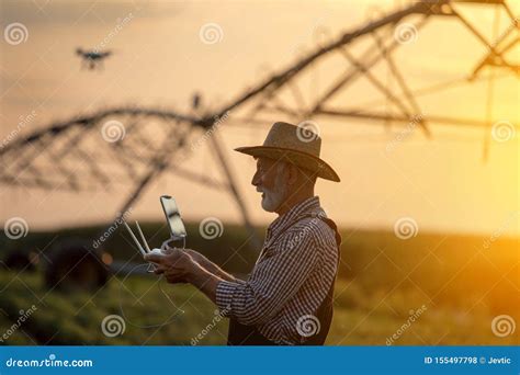 farmer  drone  field  irrigation system stock photo image  drone countryside