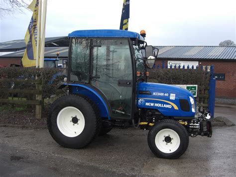 holland boomer  tractor  campey turf care systems
